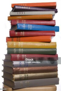 Photo of stacked yearbooks